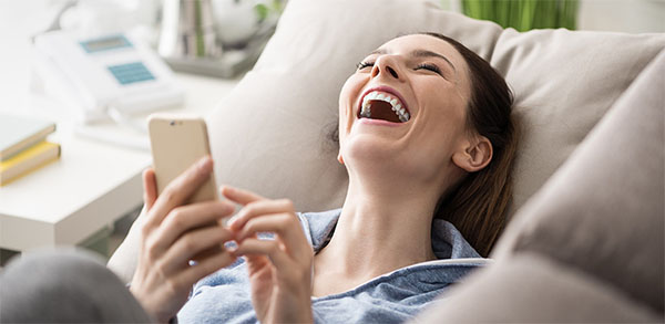 Woman reading the first text from a guy